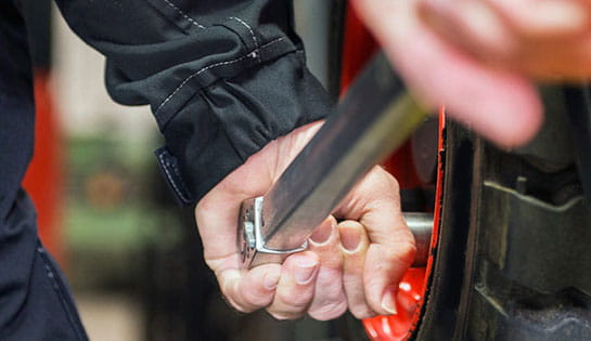Photo of a person servicing a forklift